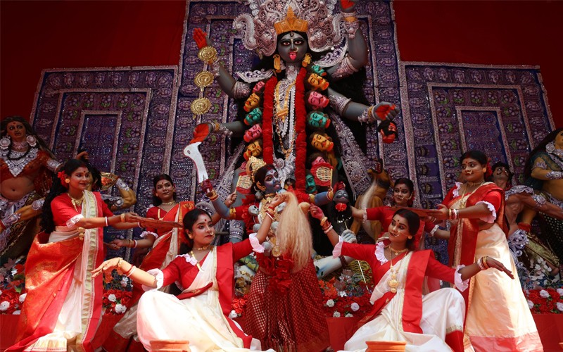 In Images: Dancers perform before Goddess Kali at a pandal in Kolkata