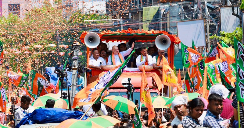 In Images: Amit Shah holds roadshow for BJP candidates in Kolkata