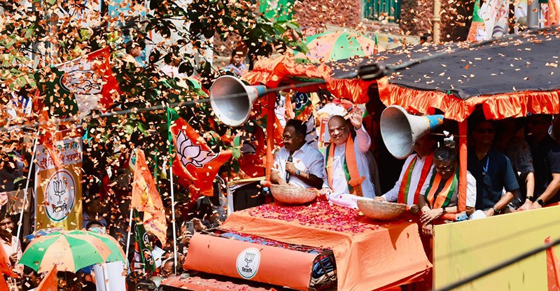 In Images: Amit Shah holds roadshow for BJP candidates in Kolkata