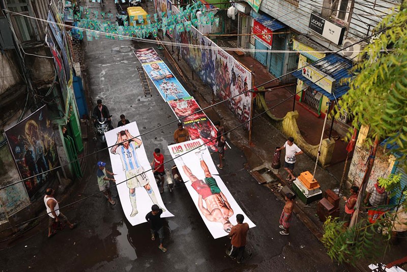 In Images: Giant Messi-Ronaldo cutouts turn a Kolkata club into a World Cup dreamland