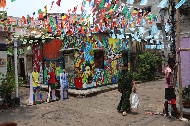 In Images: Children in Kolkata play against the backdrop of a giant World Cup masterpiece